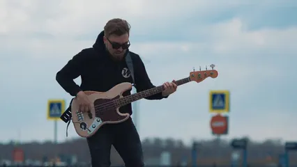 Horizontal video: A man jumping while playing electric guitar 8513926. Duration: 12 seconds. Resolution: 3840x2160