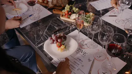 Horizontal video: Guests eating snacks and tasting wine 8764328. Duration: 10 seconds. Resolution: 3840x2160