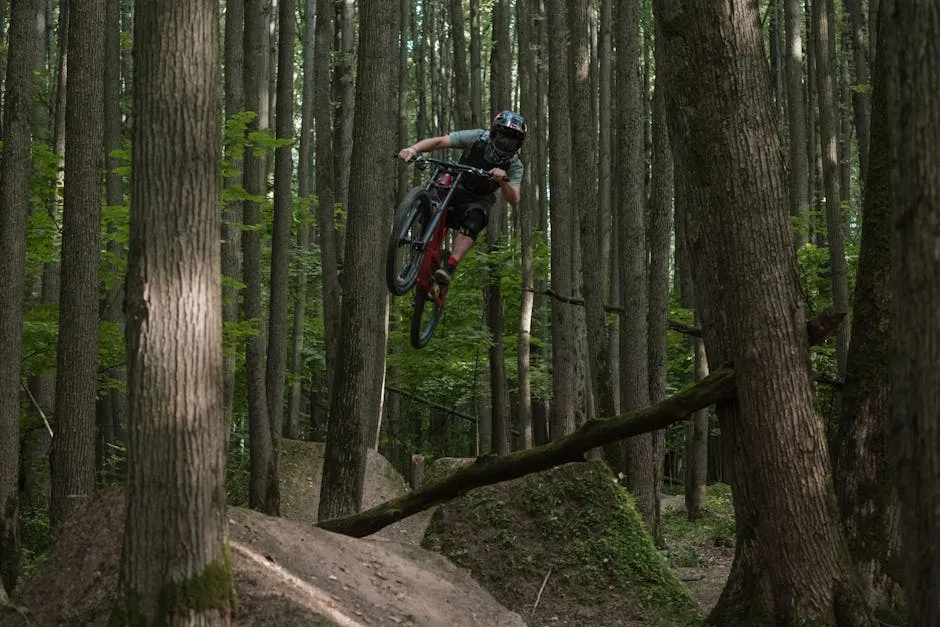 Cyclist Jumping on Ramps in the Forest