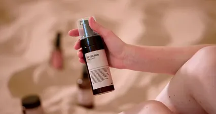 Horizontal video: Close up footage of a person applying sunscreen on her leg 9748550. Duration: 44 seconds. Resolution: 4096x2160