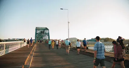 Horizontal video: Slow motion footage of a crowd of people walking on a wooden boardwalk connected to a steel bridge at daytime 2912914. Duration: 17 seconds. Resolution: 4096x2160