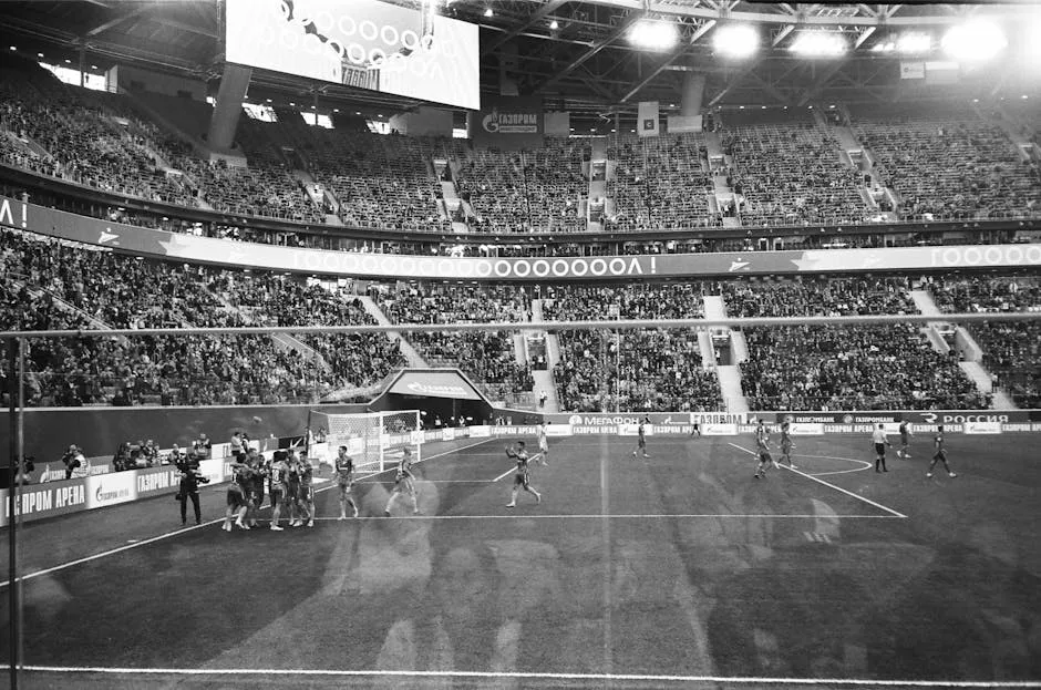 Stadium players celebrating goal during football match