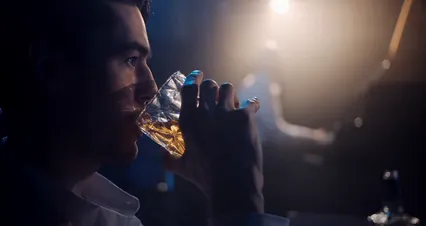 Horizontal video: A man drinking whisky at a club 9419424. Duration: 27 seconds. Resolution: 4096x2160