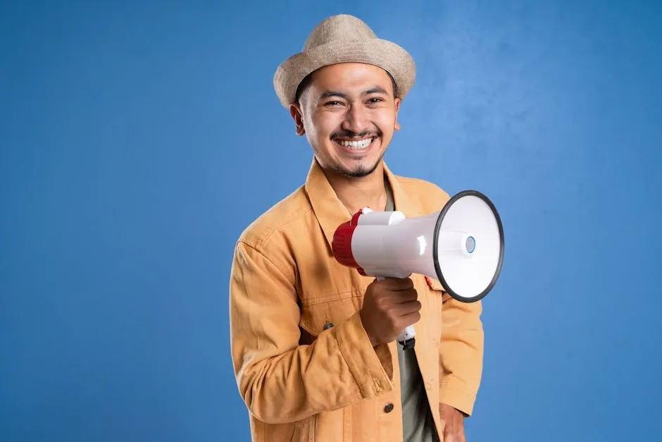 A Man Wearing a Hat While Holding a Megaphone