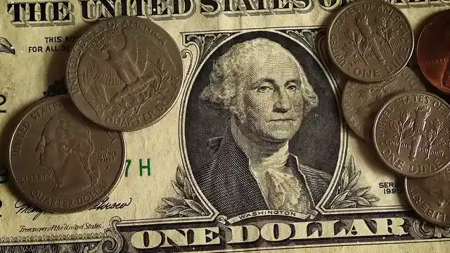Horizontal video: Close up view of a dollar and coins 1797251. Duration: 30 seconds. Resolution: 3840x2160