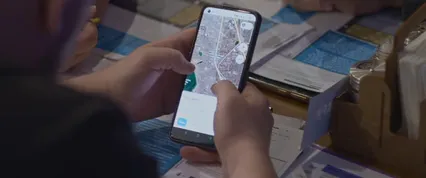 Horizontal video: A person is using a smartphone to look at a map 19789618. Duration: 6 seconds. Resolution: 4096x1716