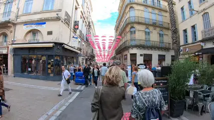 Horizontal video: A commercial street full of people and branded stores 3026357. Duration: 32 seconds. Resolution: 3840x2160