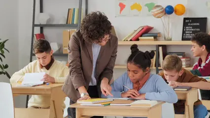 Horizontal video: Teacher guiding a student 5200016. Duration: 9 seconds. Resolution: 3840x2160