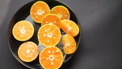 Horizontal video: A person putting sliced oranges in a bowl with ice 5945023. Duration: 10 seconds. Resolution: 1920x1080