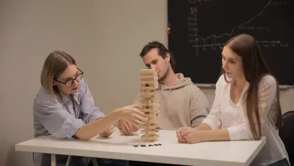 Horizontal video: Coworkers playing jenga in the office 5961112. Duration: 30 seconds. Resolution: 1920x1080