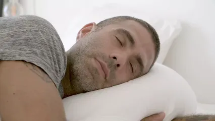 Horizontal video: Close up view of a man lying on his bed 5983684. Duration: 17 seconds. Resolution: 3840x2160