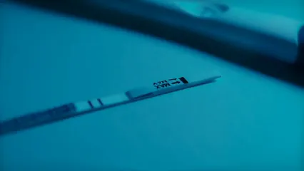 Horizontal video: Close up footage of positive result on a pregnancy test strip 6464627. Duration: 11 seconds. Resolution: 3840x2160
