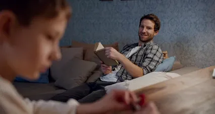 Horizontal video: A father and son reading book together 6565093. Duration: 24 seconds. Resolution: 4096x2160