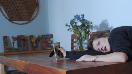 Horizontal video: An emotional woman holding picture frame 6670668. Duration: 12 seconds. Resolution: 1920x1080