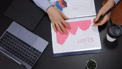 Horizontal video: A person holding a pen while writing on the graph 6930814. Duration: 11 seconds. Resolution: 3840x2160