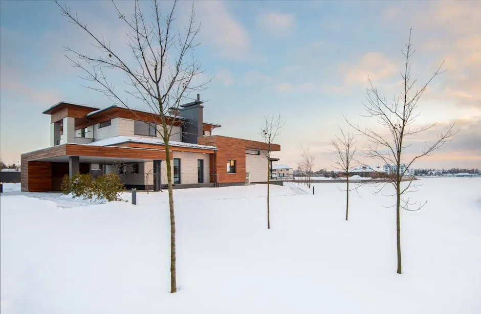 Exterior design of new residential two storey house with modern stone and wooden facade and spacious yard located in suburban area in wintertime