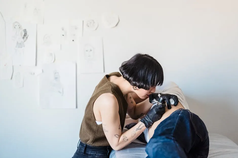 Woman Putting Tattoo on a Person