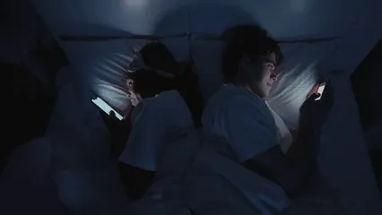 Horizontal video: Couple using smartphone before sleeping 8049570. Duration: 15 seconds. Resolution: 3840x2160