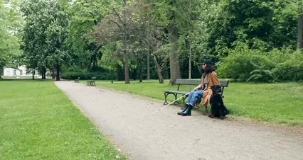 Horizontal video: Blind woman sitting beside her guide dog 8322699. Duration: 34 seconds. Resolution: 4096x2160