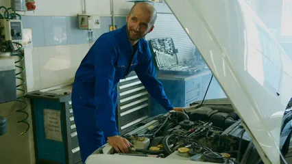 Horizontal video: A man checking the car engine 8986890. Duration: 13 seconds. Resolution: 3840x2160