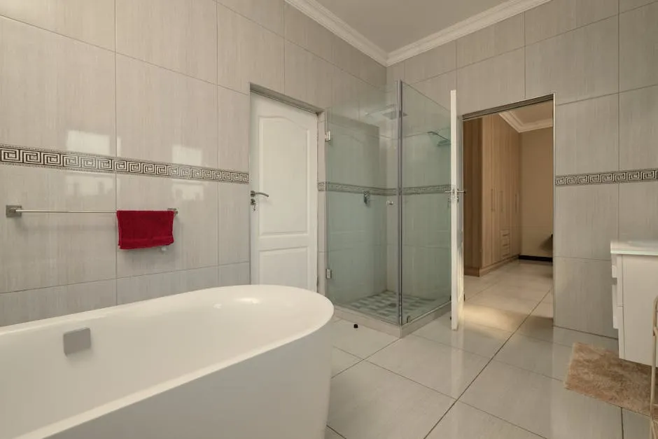 Interior of a White Clean Tiled Bathroom