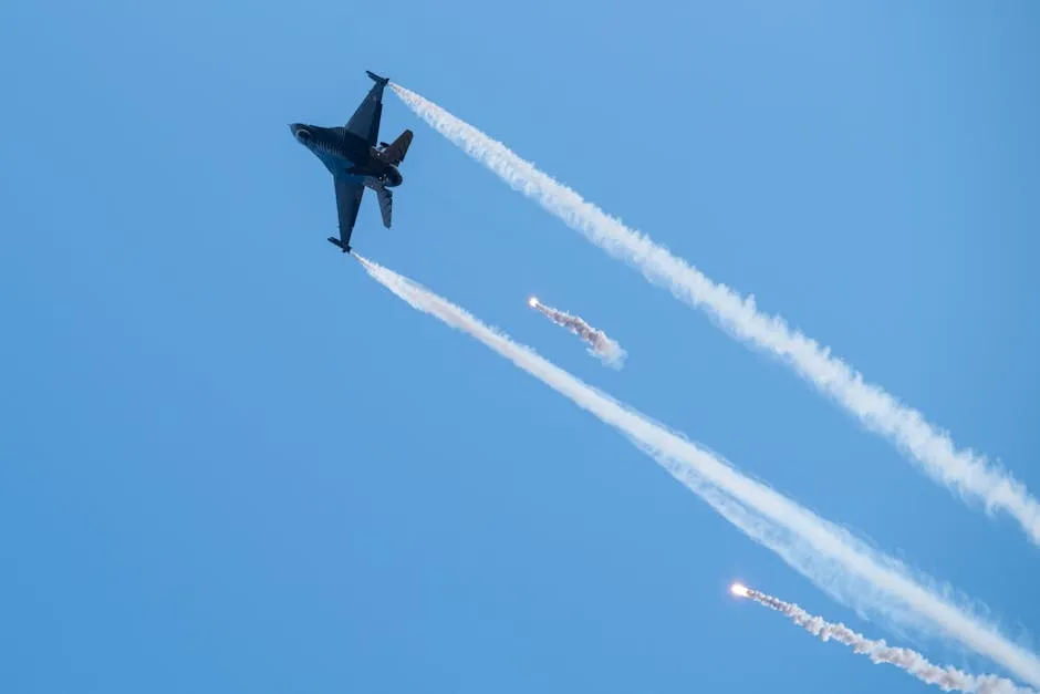 A fighter jet performing complex maneuvers with flare trails in a clear blue sky.