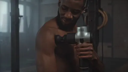 Horizontal video: A man using a massage gun on his biceps 6388399. Duration: 29 seconds. Resolution: 3840x2160