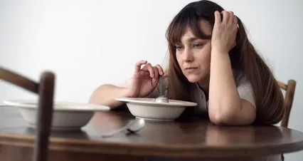 Horizontal video: Footage of a depressed woman with a food plate 7274841. Duration: 29 seconds. Resolution: 4096x2160