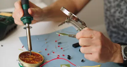 Horizontal video: Person using soldering iron while repairing circuit board 7314033. Duration: 15 seconds. Resolution: 4096x2160