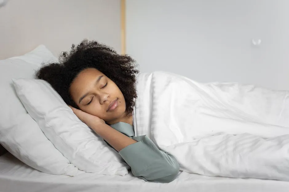 A serene scene of a woman with afro hair peacefully sleeping in a cozy bedroom.