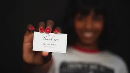 Horizontal video: Woman holding thank you card 7563970. Duration: 8 seconds. Resolution: 1920x1080