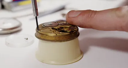 Horizontal video: Close up view of a man repairing a watch 8321915. Duration: 22 seconds. Resolution: 4096x2160