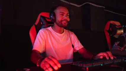 Horizontal video: Person playing a computer game in a dark room 9070661. Duration: 12 seconds. Resolution: 3840x2160