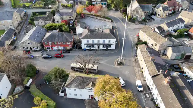 Horizontal video: Charming aerial view of a quaint village intersection 29082743. Duration: 41 seconds. Resolution: 3840x2160
