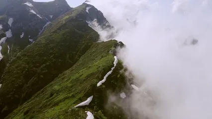 Horizontal video: Drone flying over the mountain peak 4763824. Duration: 14 seconds. Resolution: 3840x2160