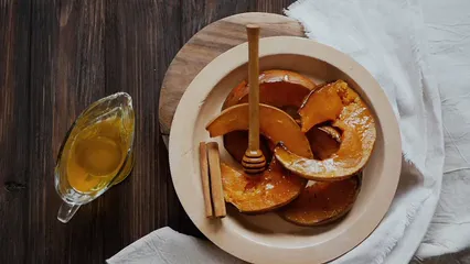 Horizontal video: Honey pouring on baked pumpkin 5644957. Duration: 27 seconds. Resolution: 1920x1080