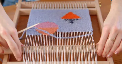 Horizontal video: A person weaving using a hand loom 6653611. Duration: 28 seconds. Resolution: 4096x2160