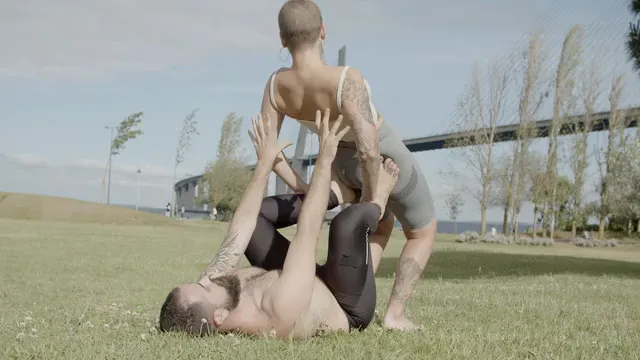 Horizontal video: Man and woman doing yoga 8712235. Duration: 18 seconds. Resolution: 3840x2160