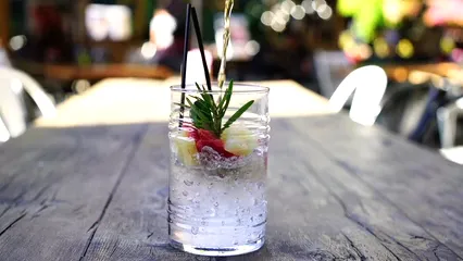 Horizontal video: Liquid being poured into a glass of iced drink 2345459. Duration: 25 seconds. Resolution: 3840x2160