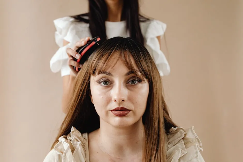 A Person Brushing another Woman's Hair