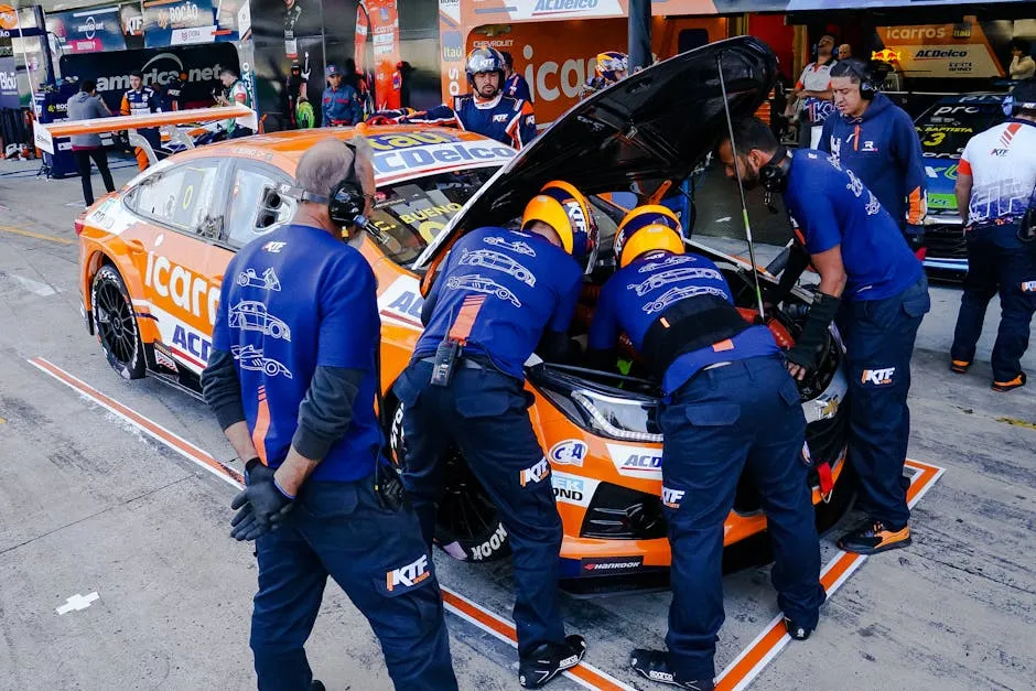 Car Mechanics Fixing a Race Car