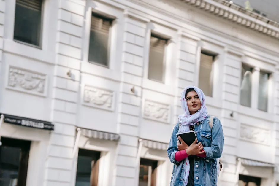 Gentle ethnic woman in headscarf and denim jacket