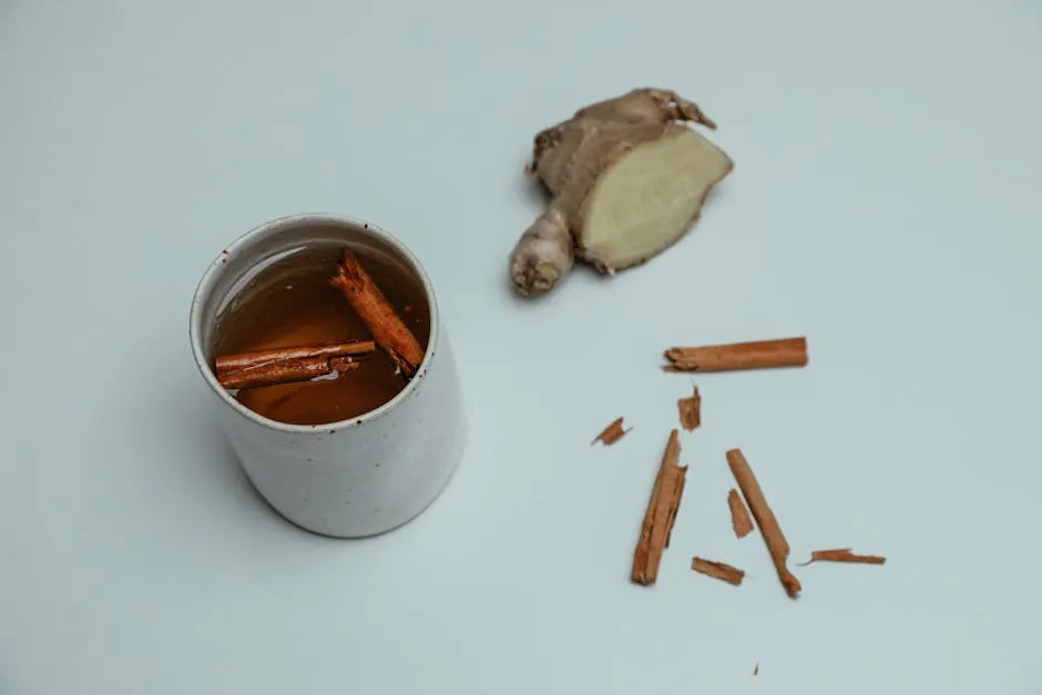 Cup of Ginger Tea with Cinnamon Sticks