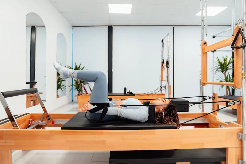 Woman in Gray Top Doing Pilates Workout