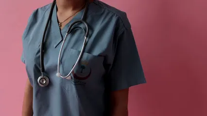 Horizontal video: A person holding a pink ribbon 7659133. Duration: 18 seconds. Resolution: 1920x1080
