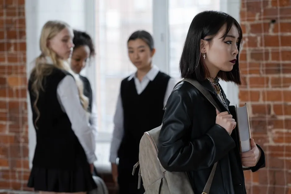 Shallow Focus of a Girl in Black Leather Jacket Holding a Book