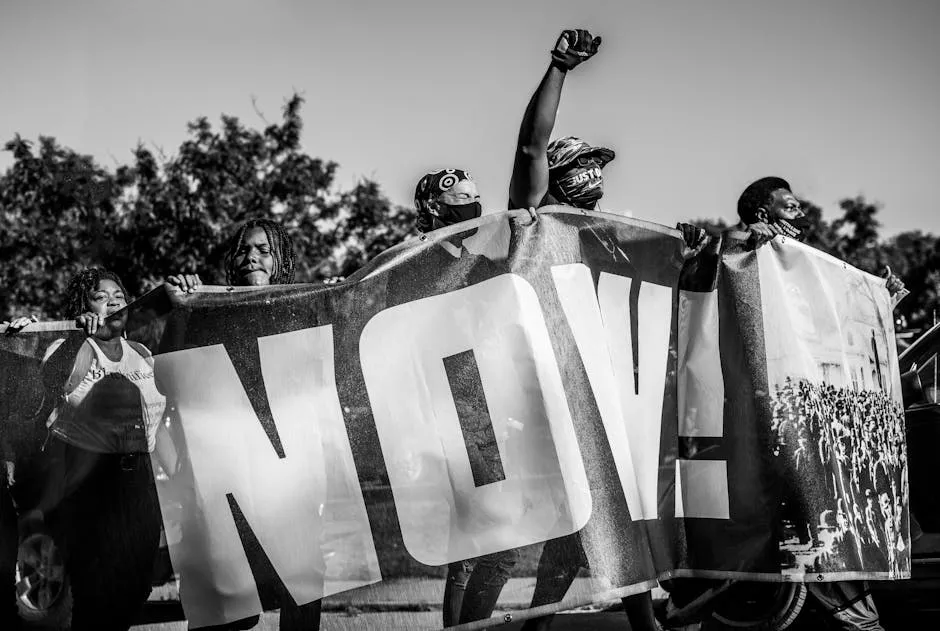 People Holding Big Sign on Protest