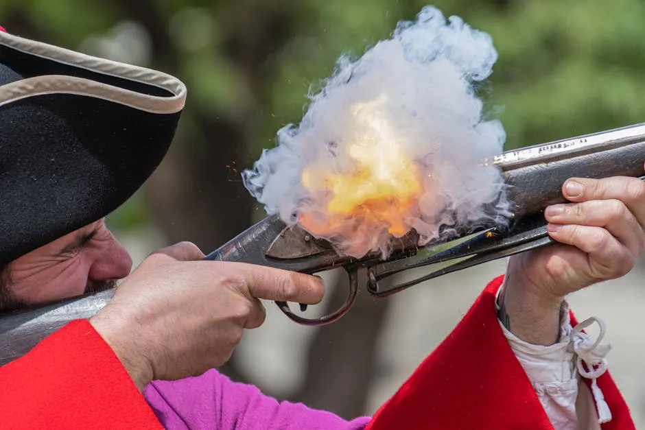 A reenactor fires a historic musket with smoke and flame during a military event.