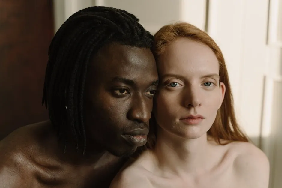 Close-up portrait of a diverse couple emphasizing intimacy and connection.