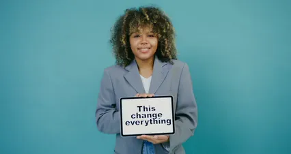 Horizontal video: Woman posing while holding signage with a message 7534430. Duration: 7 seconds. Resolution: 4096x2160